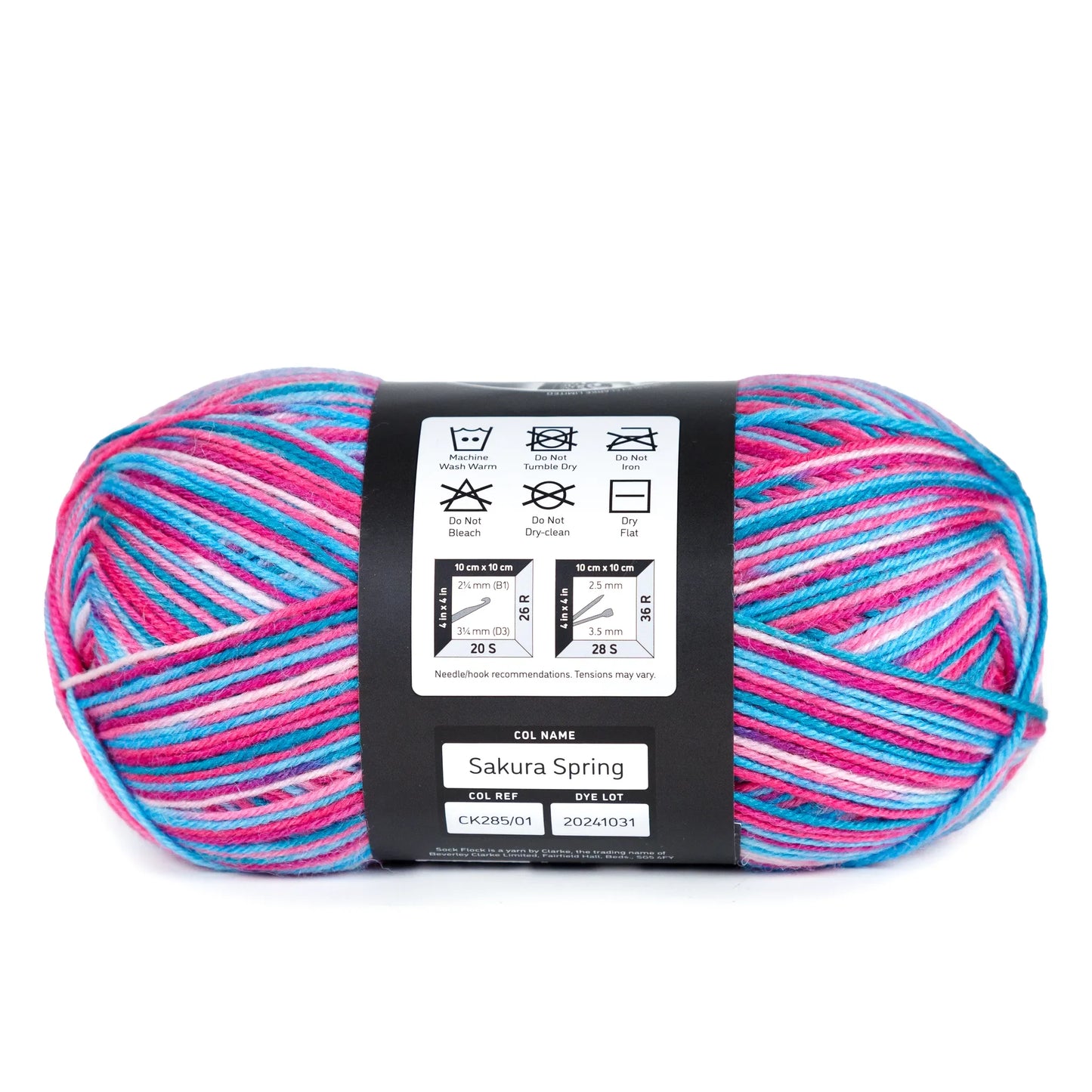 Side view of Sock Flock – Sakura Spring yarn ball laid flat to show label with care symbols on white background