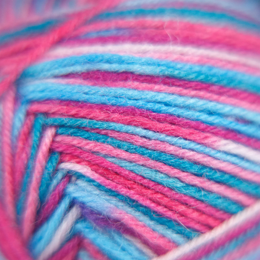 Macro close-up of Sock Flock – Sakura Spring yarn showing strand structure and vibrant colour blend