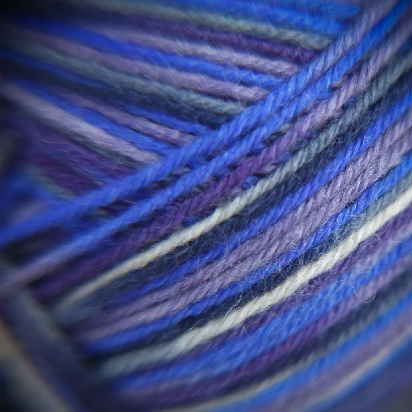 Macro detail of Sock Flock ‘Blue Moon’ yarn showing tonal blues and soft twist texture. 75% New Zealand wool, 25% recycled nylon.