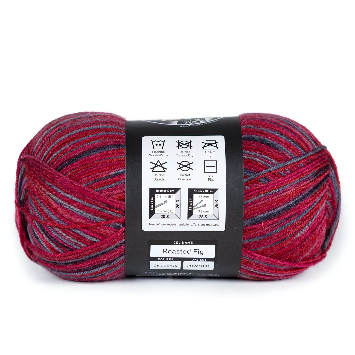 Side view of Sock Flock ‘Roasted Fig’ yarn ball laid on white background, label focused on care and batch info.