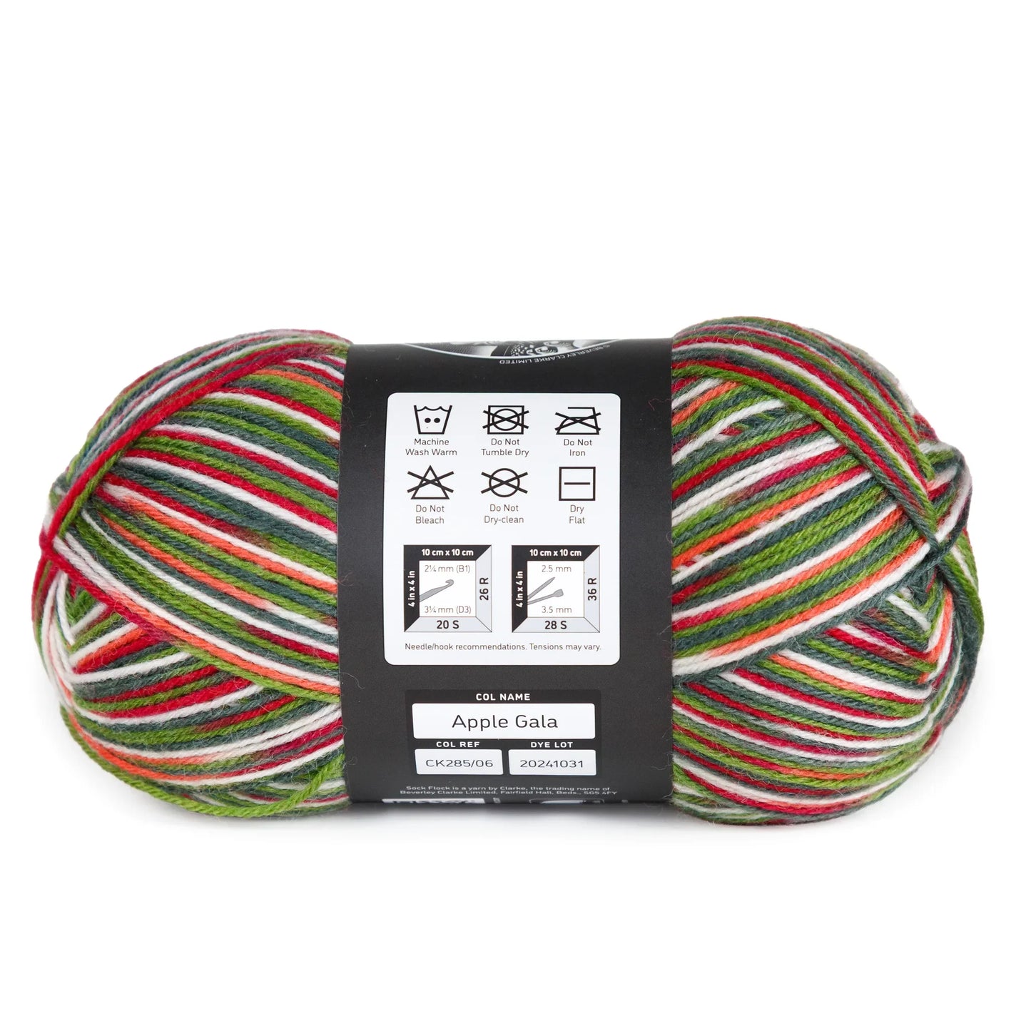 Side view of Apple Gala yarn ball laid on white background, label with washing instructions in view.
