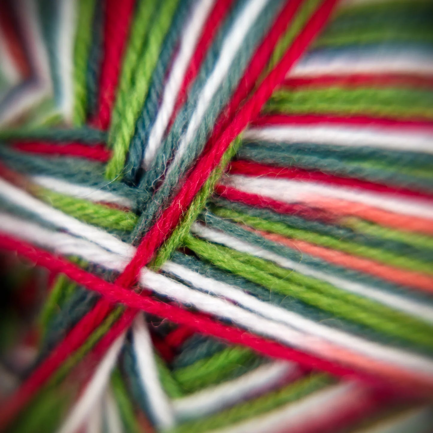 Macro close-up of Apple Gala yarn fibre structure with orchard-inspired tones and soft spin detail.