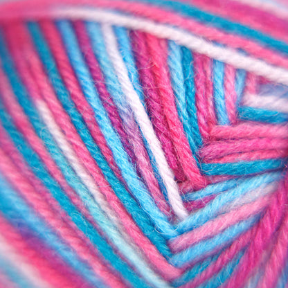 Macro close-up of Sock Flock – Sakura Spring yarn strands showing vivid pink, aqua blue and white fibre tones