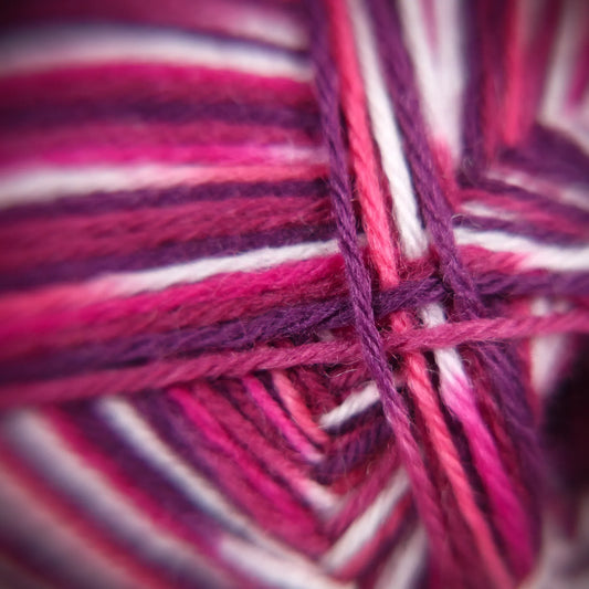 Macro image of Raspberry Ripple yarn showing tonal contrast and soft ply definition.