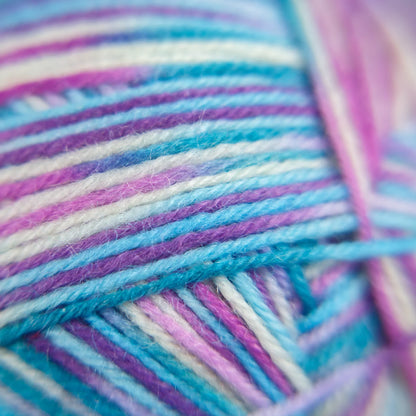 Macro image of Sea Glass yarn showing delicate shift between green-glass tones and creamy white.